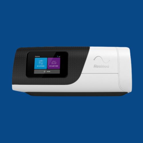 Resmed AirSense 11 CPAP machine against a dark blue background