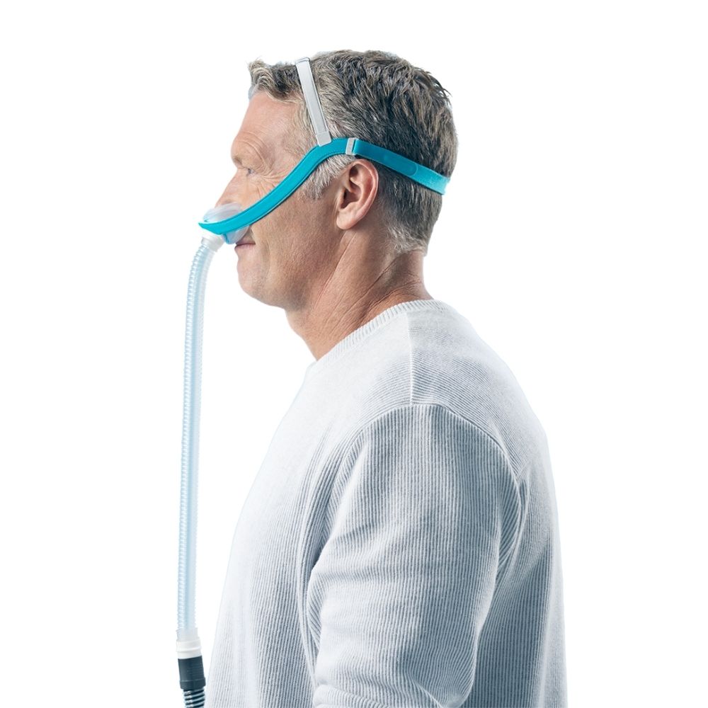 Side profile of a person wearing the F&P Evora Nasal Mask with tube connected