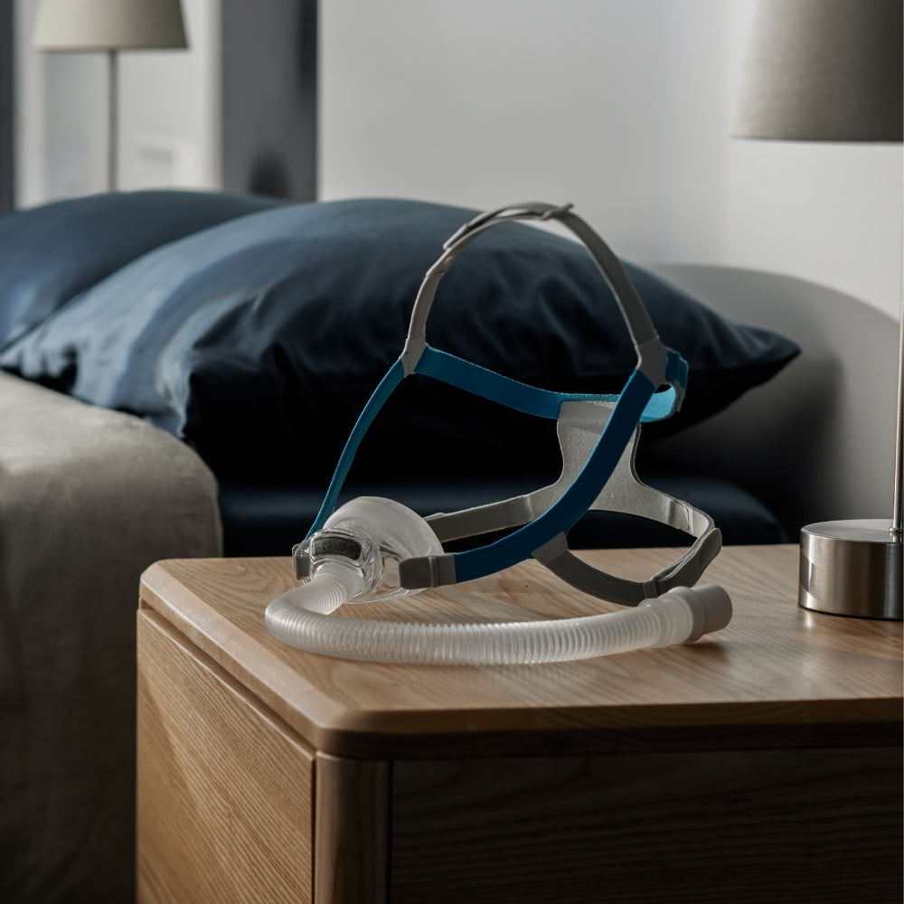 F&P Nova Nasal CPAP Mask displayed on a bedside table