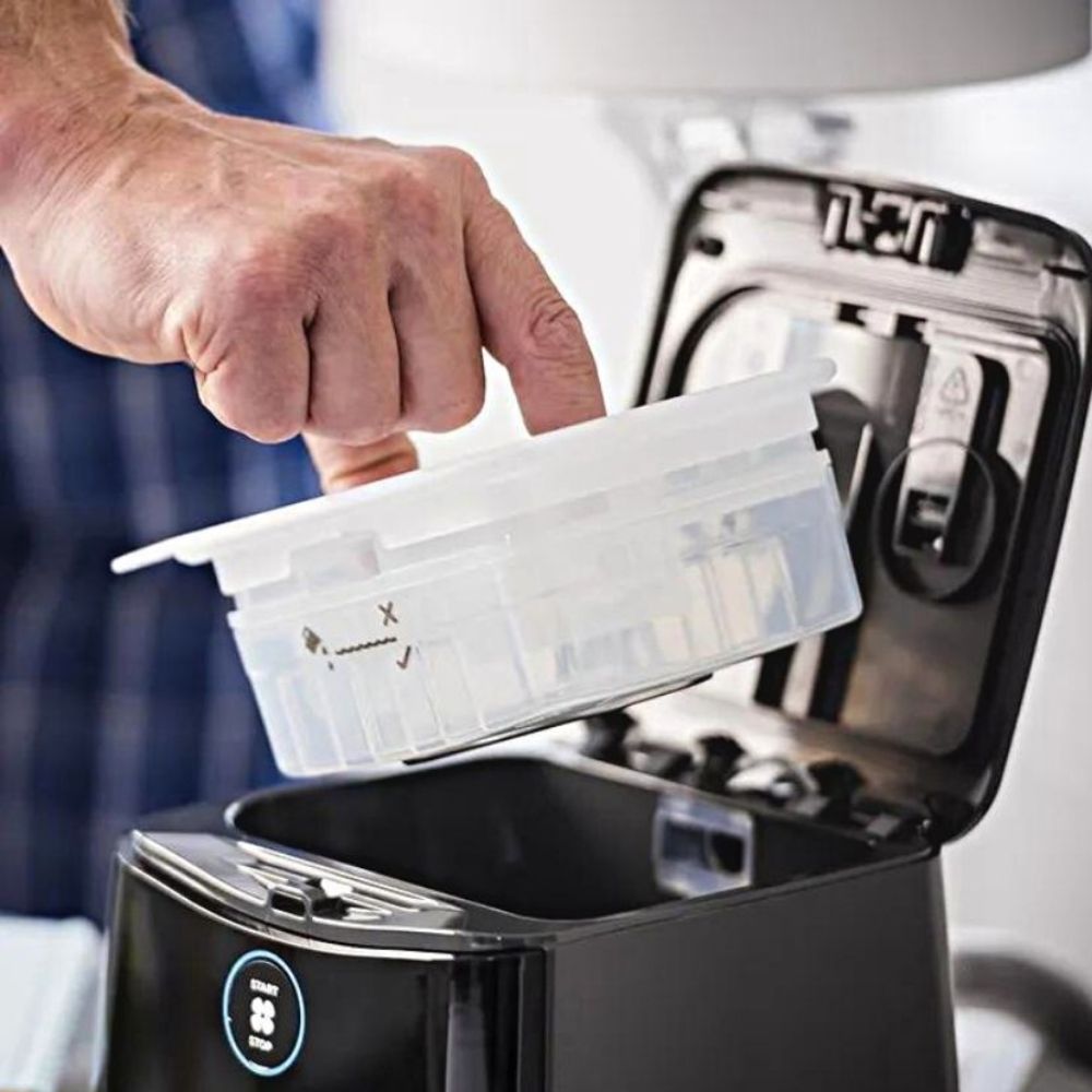 Person placing the water chamber back into the SleepStyle CPAP machine