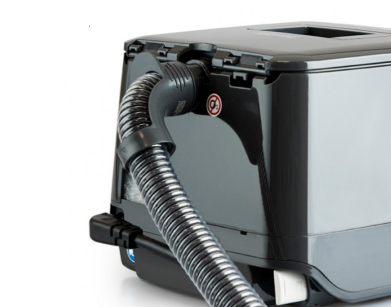 ThermoSmart Breathing Tube plugged into back of F&P SleepStyle CPAP machine