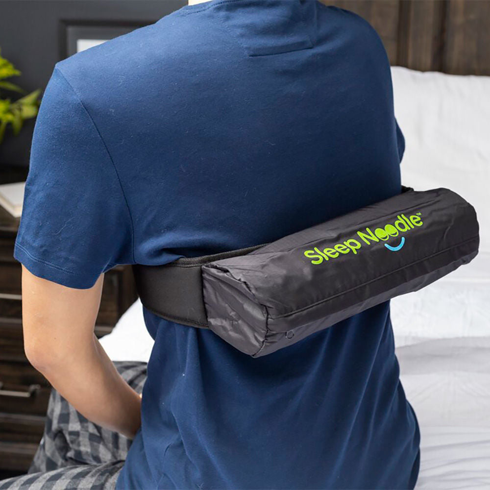 Person with the Kego Sleep Noodle Positional Sleep Aid on