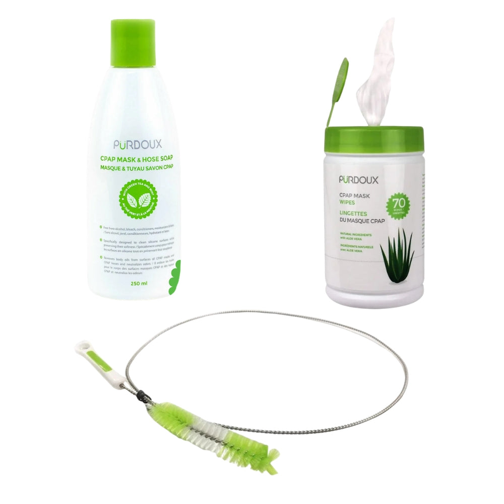 Purdoux 250ml bottle of CPAP mask and hose soap, a canister of wipes, and a long-handled cleaning brush on a white background.