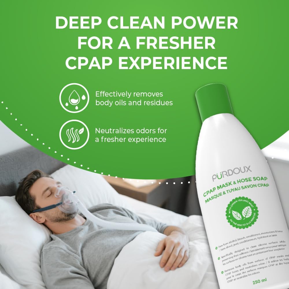 Person using a CPAP mask with a bottle of Purdoux CPAP mask and hose soap in the foreground