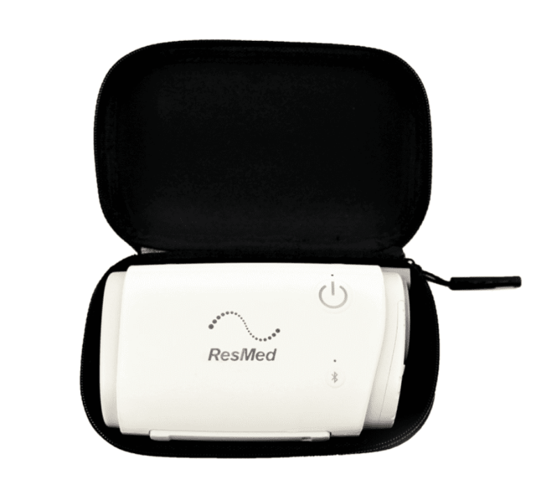 Unzipped and opened view of the ResMed hard travel case with an AirMini stored inside