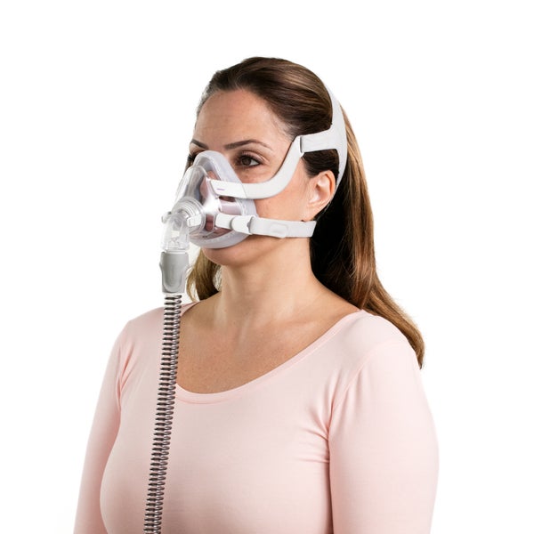 Woman wearing the ResMed AirTouch F20 for Her full face CPAP Mask with tube