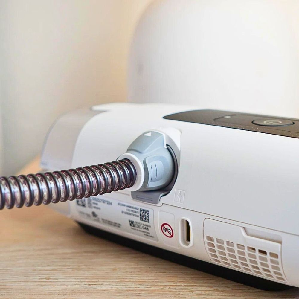 Back of AirSense 11 CPAP machine showing he ClimateLineAir 11 heated tube attached