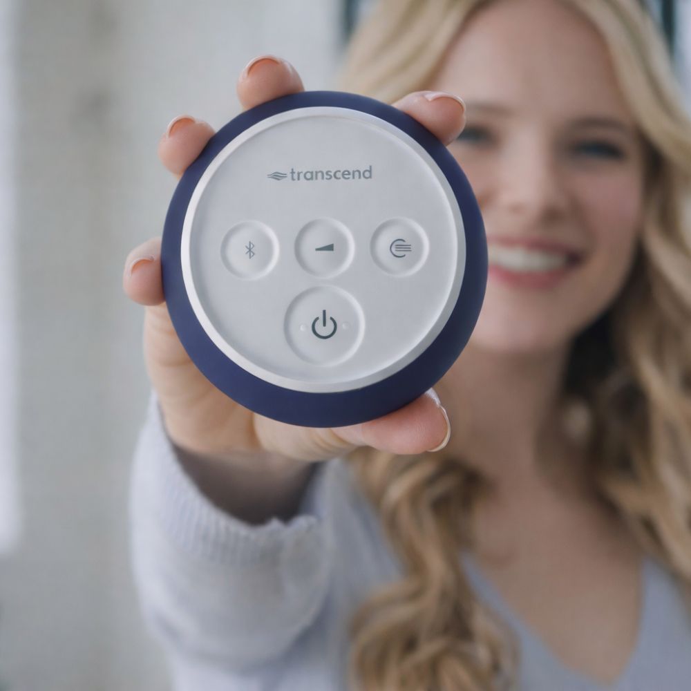 Woman holding a blue Transcend Micro 510 CPAP device with buttons on a blurred background
