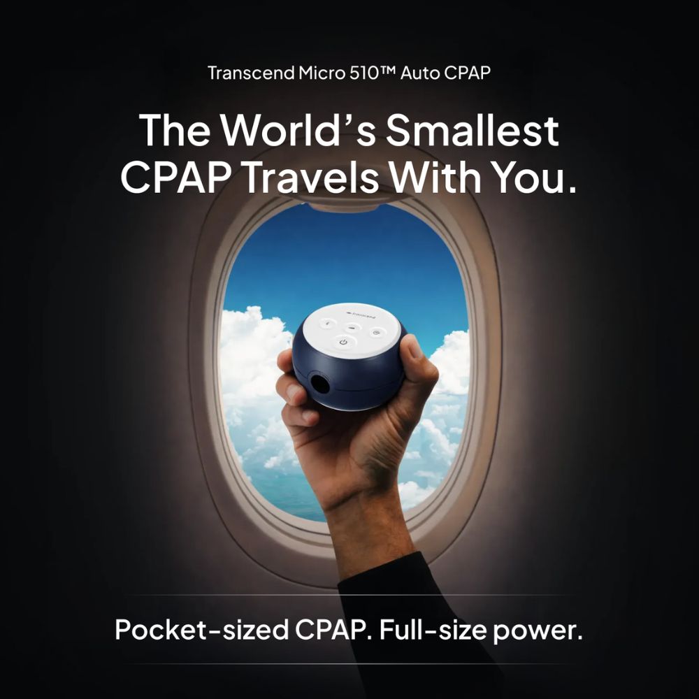 Hand holding a small CPAP device with airplane window and sky background, promoting the Transcend Micro 510 Auto CPAP. Text includes "The World's Smallest CPAP Travels With You. Pocket-sized CPAP. Full-size power."