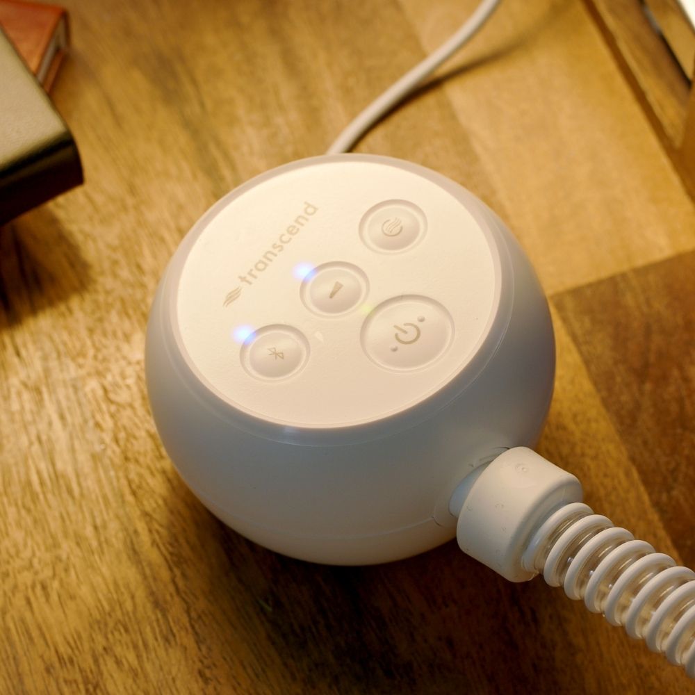 Transcend Micro CPAP device on a wooden surface