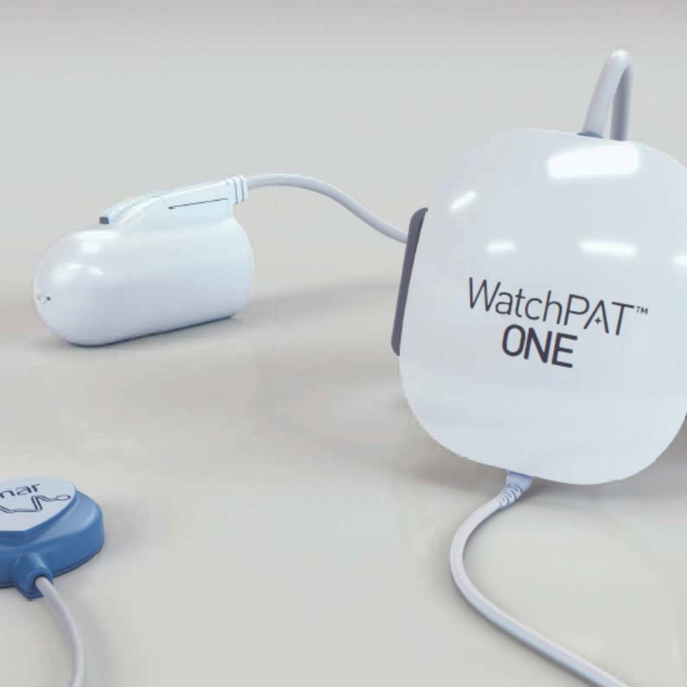 A white WatchPAT ONE home sleep apnea test shown on a light gray studio background.