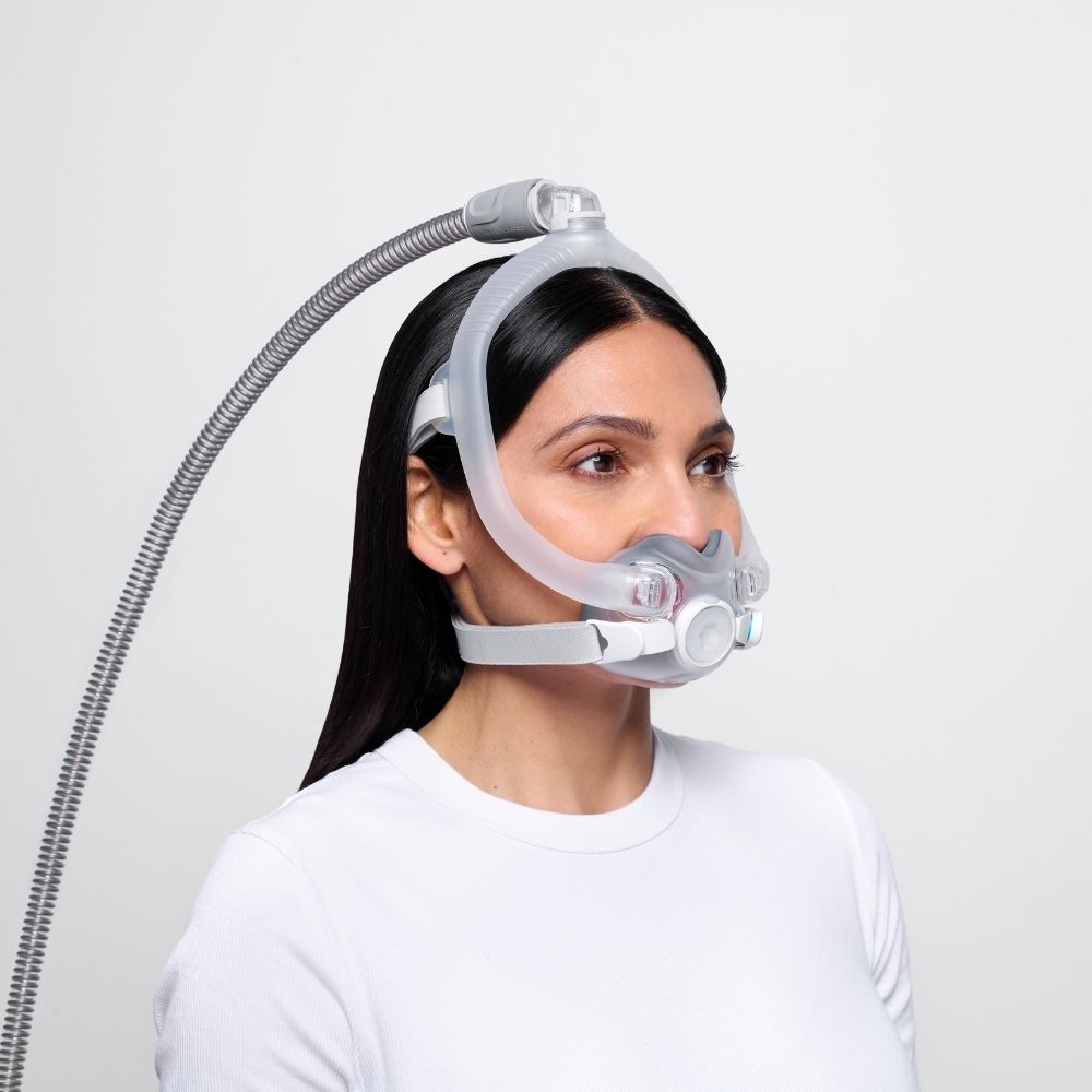 Side profile of a person wearing the AirTouch F30i full face mask with the tube attached to the top