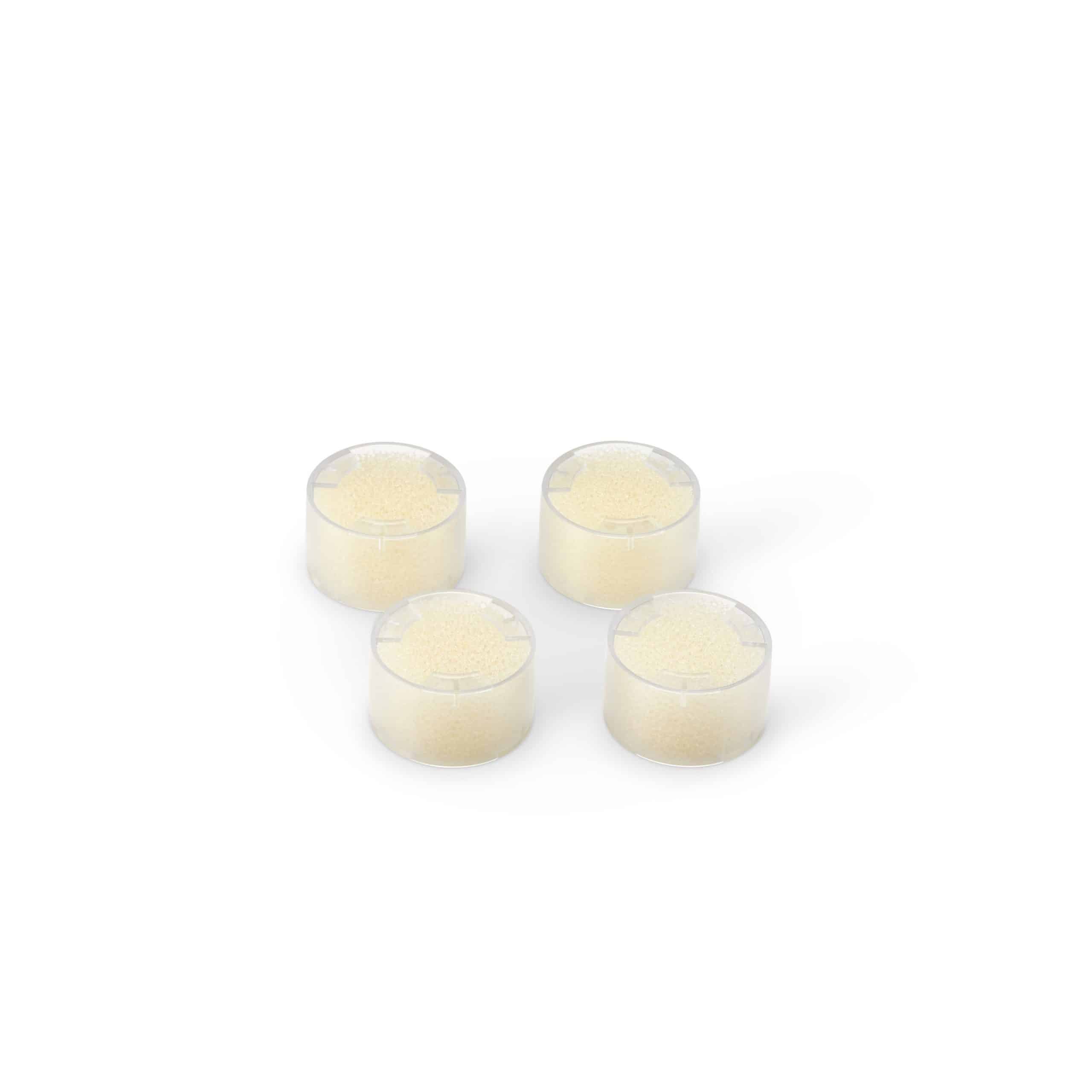 Four Micro AirMist replacement cartridges on a white background